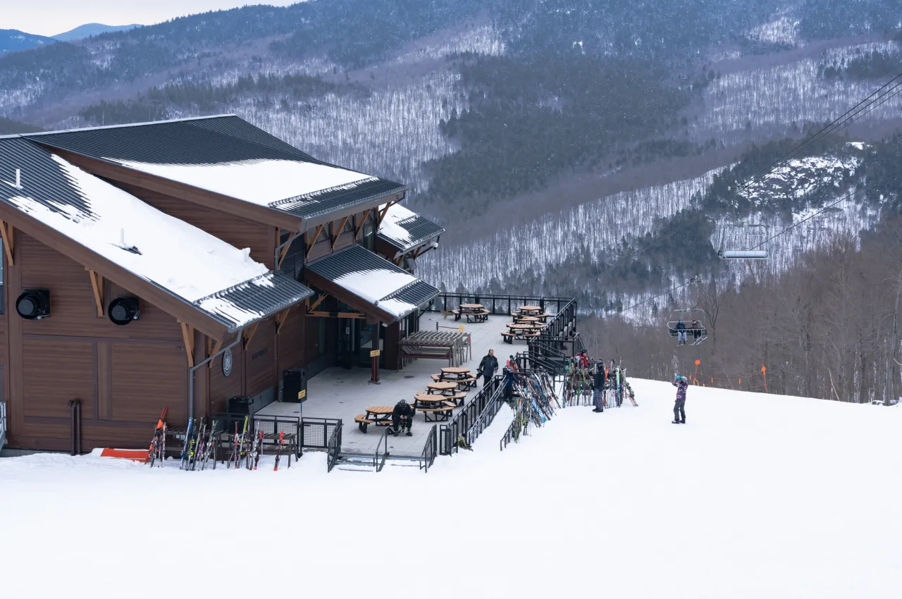 A large ski lodge on the snow-covered mountain side