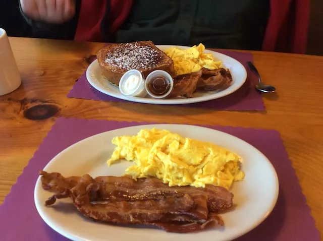 In front, my breakfast. Behind it, my husband's order of the day's special, which has French toast and sausage along with the bacon and eggs.
