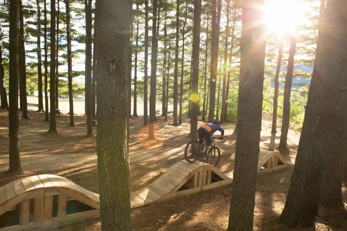 A mountain biker rides on one of the features at the Wilmington Bike Park.