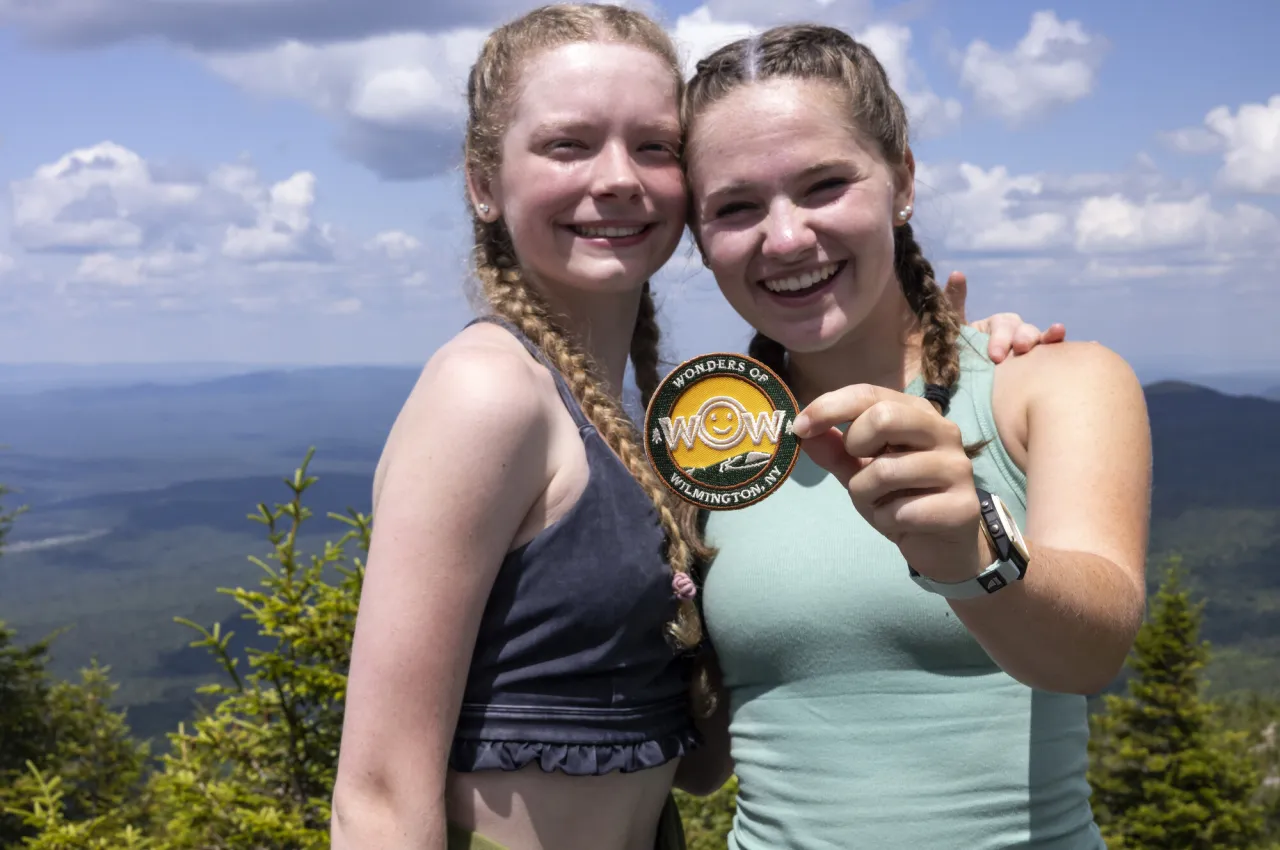 Two girls with a hiking patch