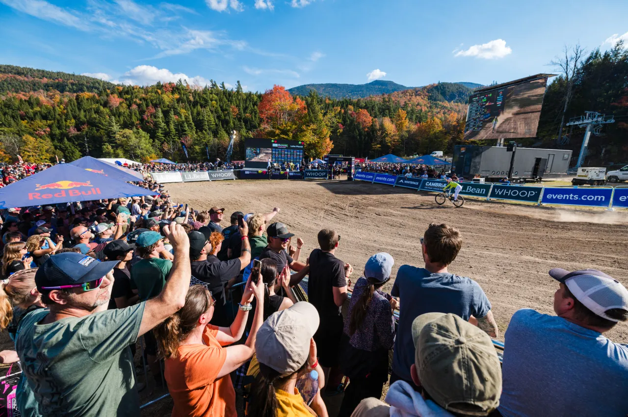 Crowd gathered at finish line of UCI MTB World Series race at Whiteface Mountain in October as competitor enters finish arena