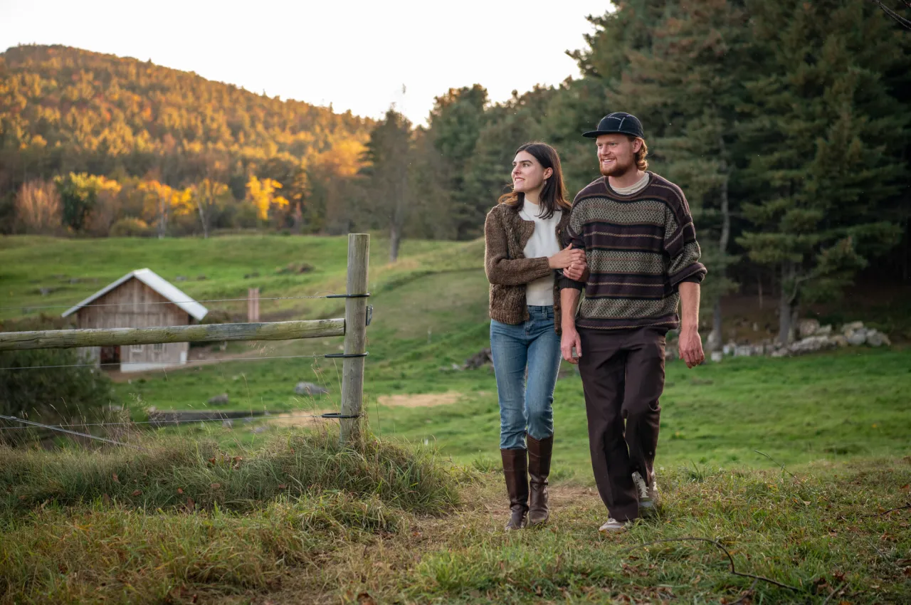 A couple at a farm in the Whiteface Region.