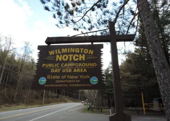 A brown and yellow sign for Wilmington Notch