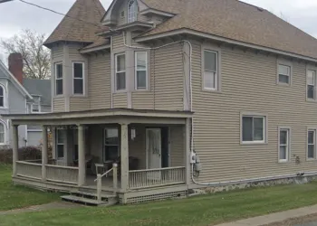 Brown Vinyl exterior of a church outbuilding
