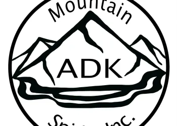 A circular logo with mountains and water with the name ADK Mountain Spirits Inc incorporated.