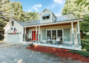 A welcoming front entry with red door