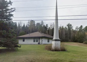 A white building with tall spire.
