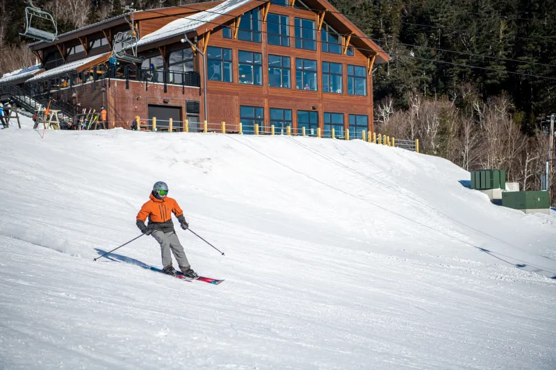 A skier passes mids-station.