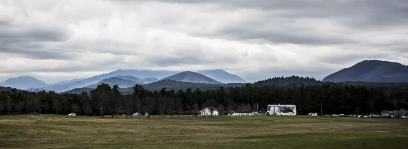 Landscape image of Asgaard Farm with mountains in the background.