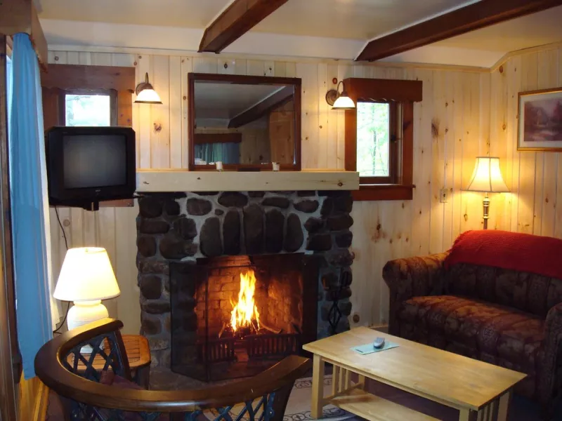 A fireplace in a cozy room at the Wilderness Inn.