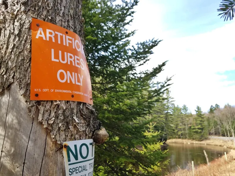 Artificial lures only sign along the Ausable River.