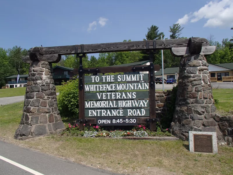 Road entrance sign for Whiteface Veterans' Memorial Highway