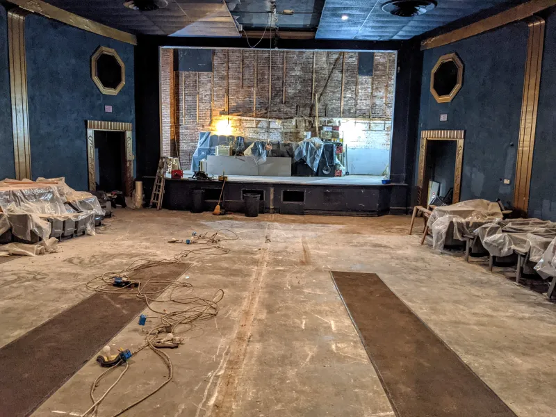A gutted, old theater is ready to be filled with new flooring and seating.