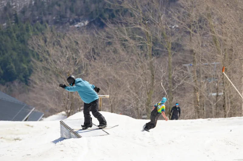 Snowboarders in the terrain park at Whiteface.