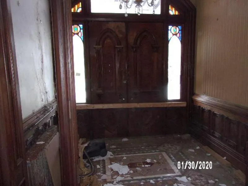 The severely damaged entryway of Graves Mansion