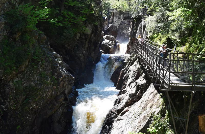 Steep waterfalls at High Falls Gorge with a boardwalk on the gorge slides.