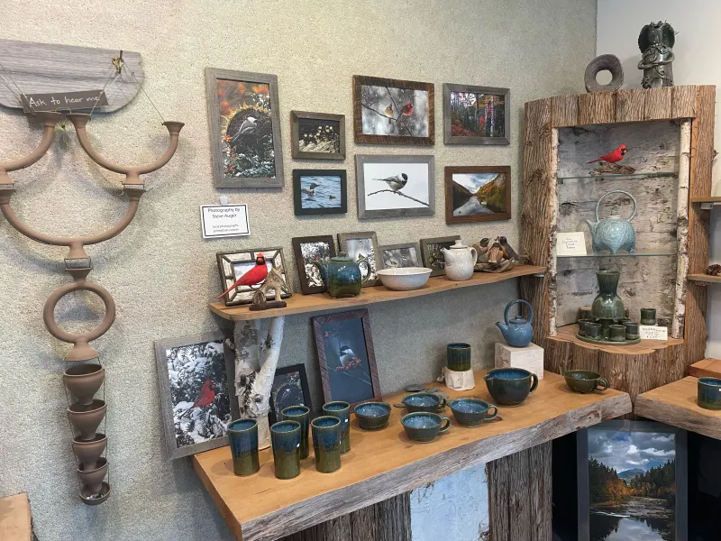 Various art and ceramics on display in a shop.