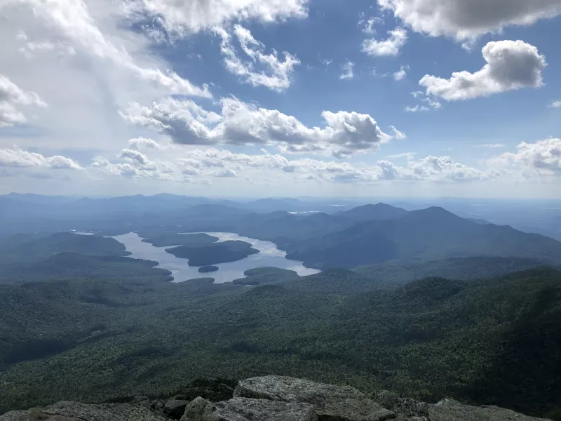 The view of trees and lakes from the Whiteface Summit