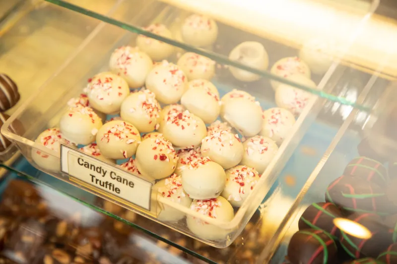 Close up of a display of white chocolate candy cane truffles.
