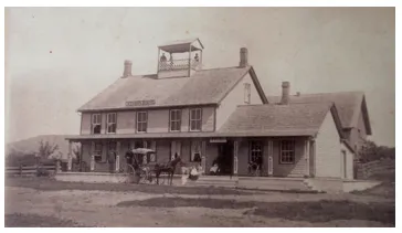 Storrs house in black and white with horse-drawn carriage in front of it.