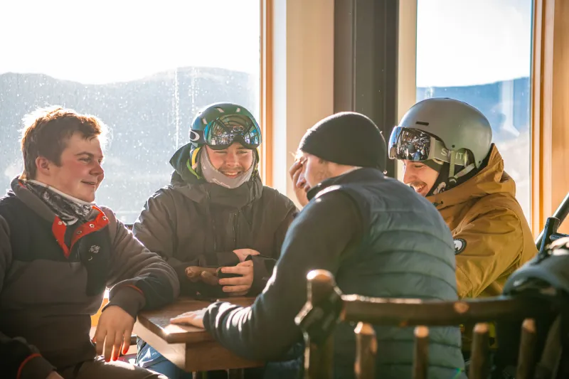 A group of skiers order food in the lodge.