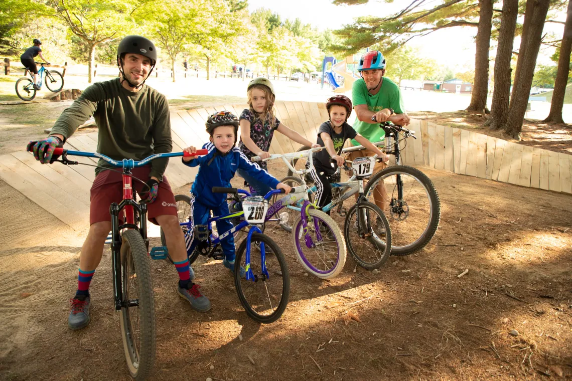 A group of a happy children on mountain bikes.