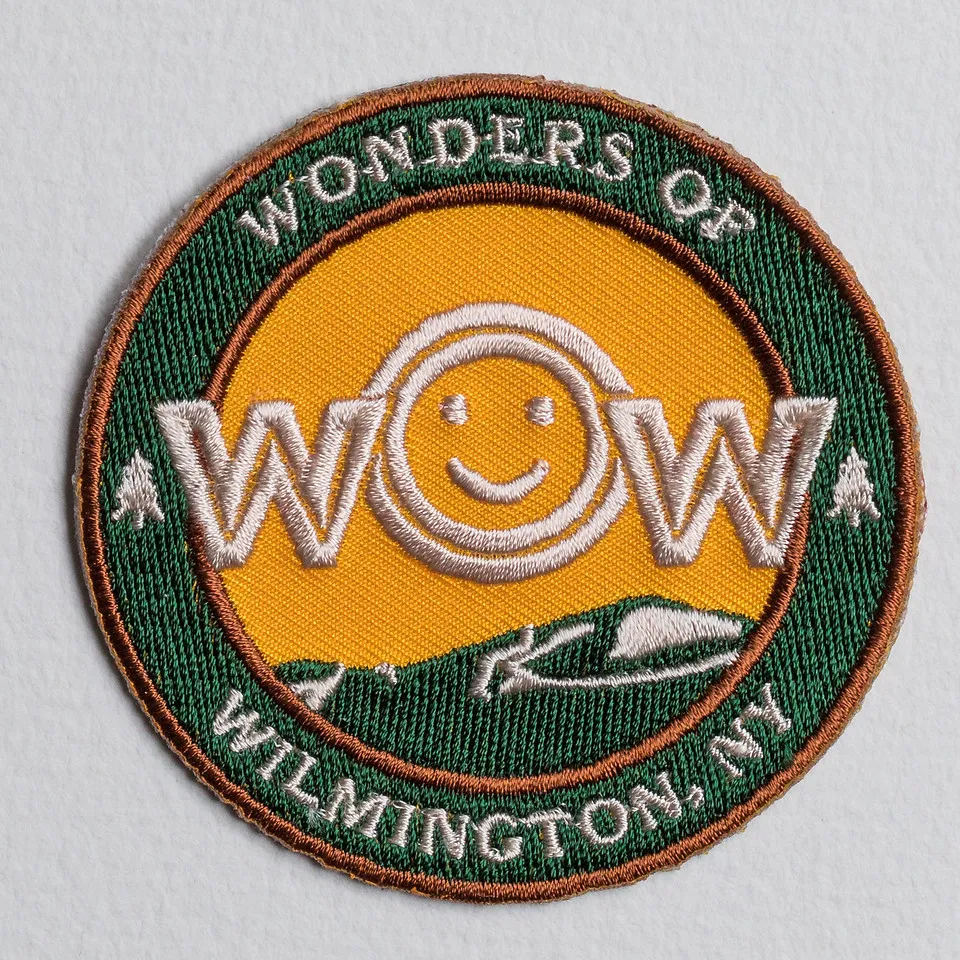 Wow Family Fun patch. Yellow with smile face.