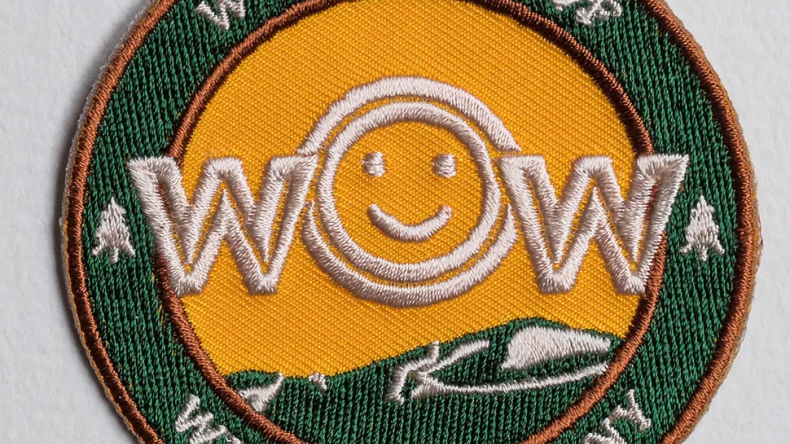 Wow Family Fun patch. Yellow with smile face.